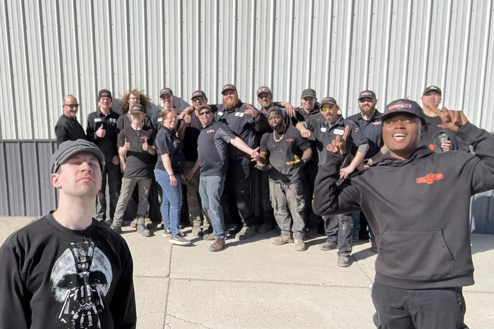 Isaak Hyde with a colleague from Capture the Moment and the crew at Kolar Tires, photographed on location.